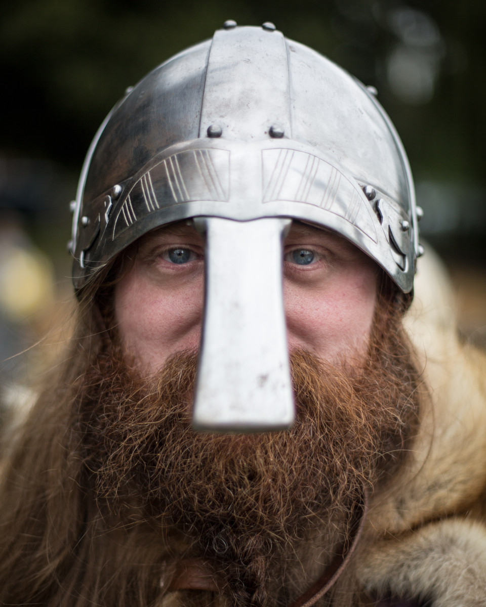 Man with a beard and viking helmet